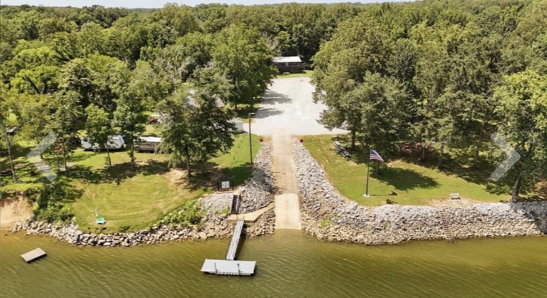 954 Stokes Lane Bath Springs, TN 38311 - Photo 15 of 15 a view of swimming pool with a yard and large trees