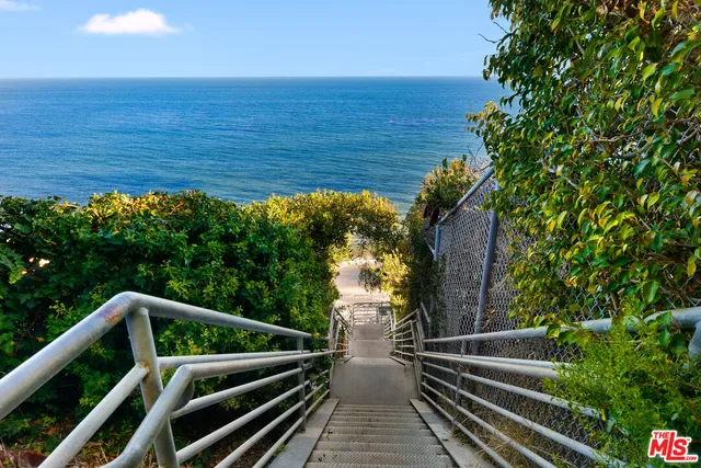 a bed room with bed and a large window