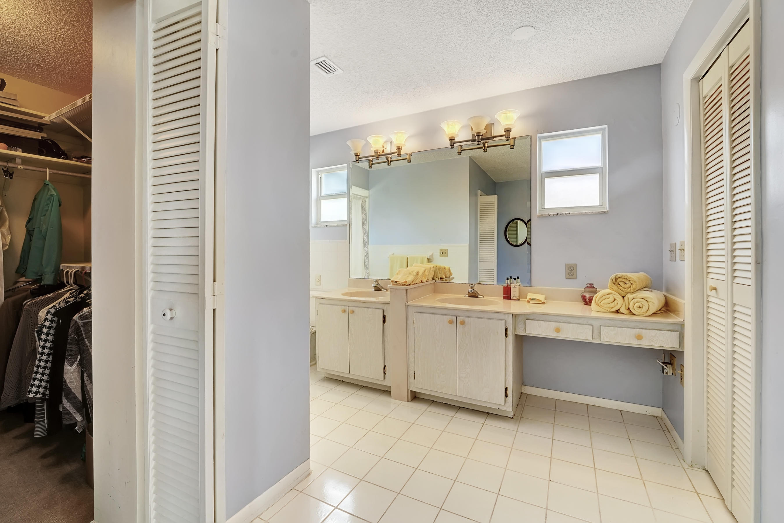 16 Sailfish Lane Ocean Ridge, FL 33435 - Photo 23 of 37 a bathroom with a sink and a mirror