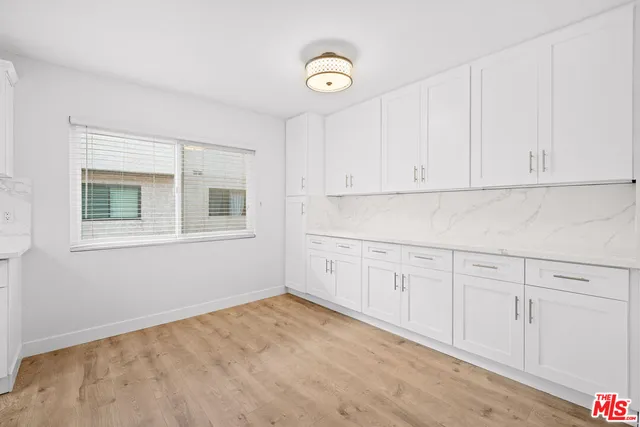 a view of empty room with fireplace
