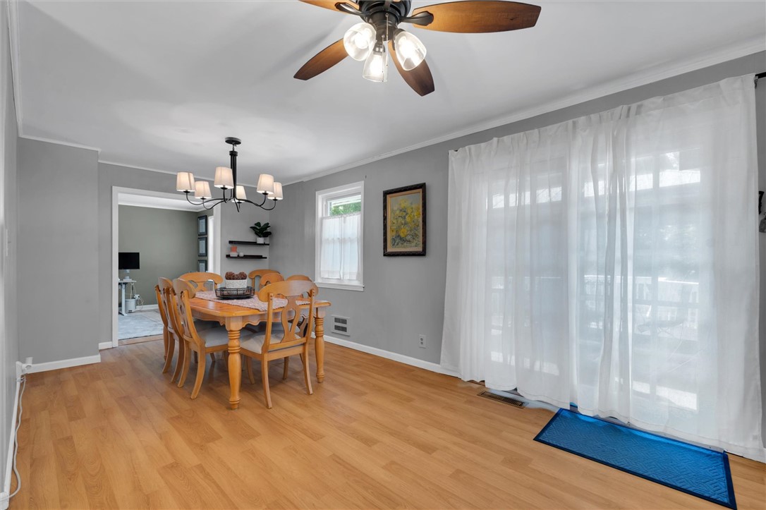1815 Pearman Dairy Road Anderson, SC 29625 - Photo 13 of 35 Dining area boasts rich wood flooring and a refreshing ceiling fan for comfort.