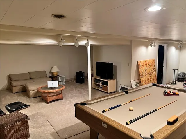 a room with furniture and a flat screen tv