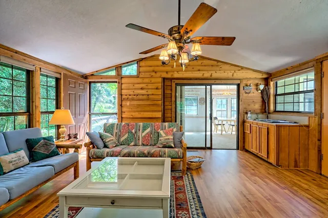 a view of a room with furniture and windows