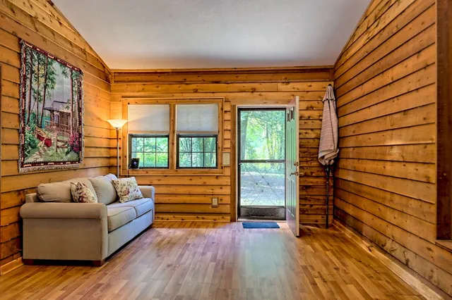 a view of house with a yard