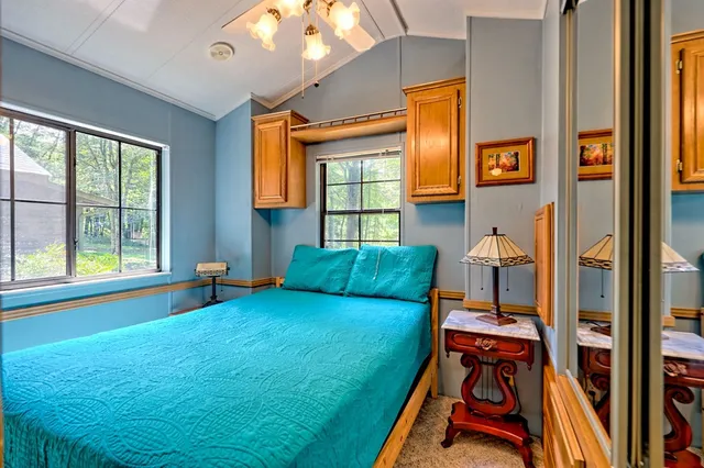 an aerial view of a house with a big yard