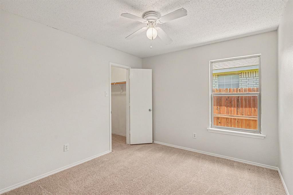 2541 Rivers Edge Drive Fort Worth, TX 76118 - Photo 18 of 31 an empty room with windows and fan