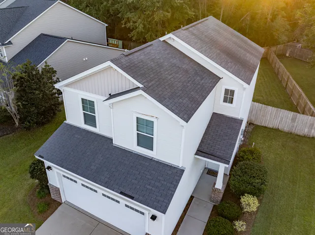 an aerial view of house with yard