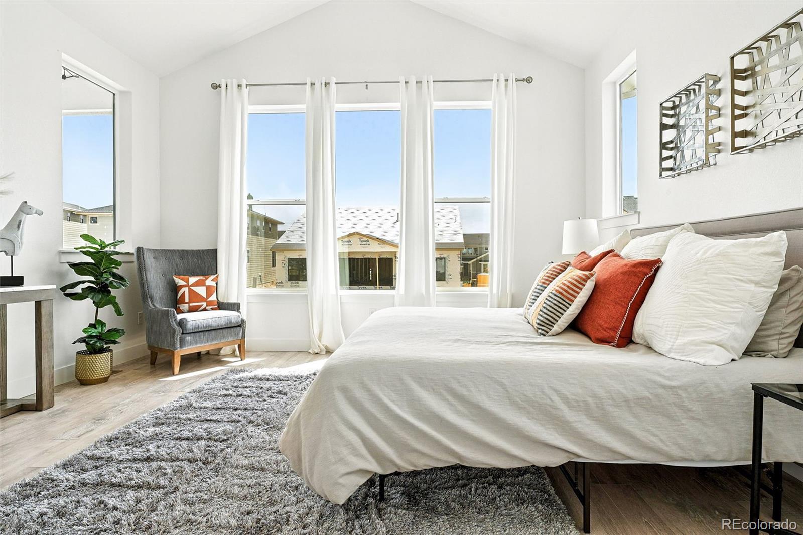 4855 Saddle Iron Road Castle Rock, CO 80104 - Photo 27 of 50 a bedroom with a bed and a large mirror