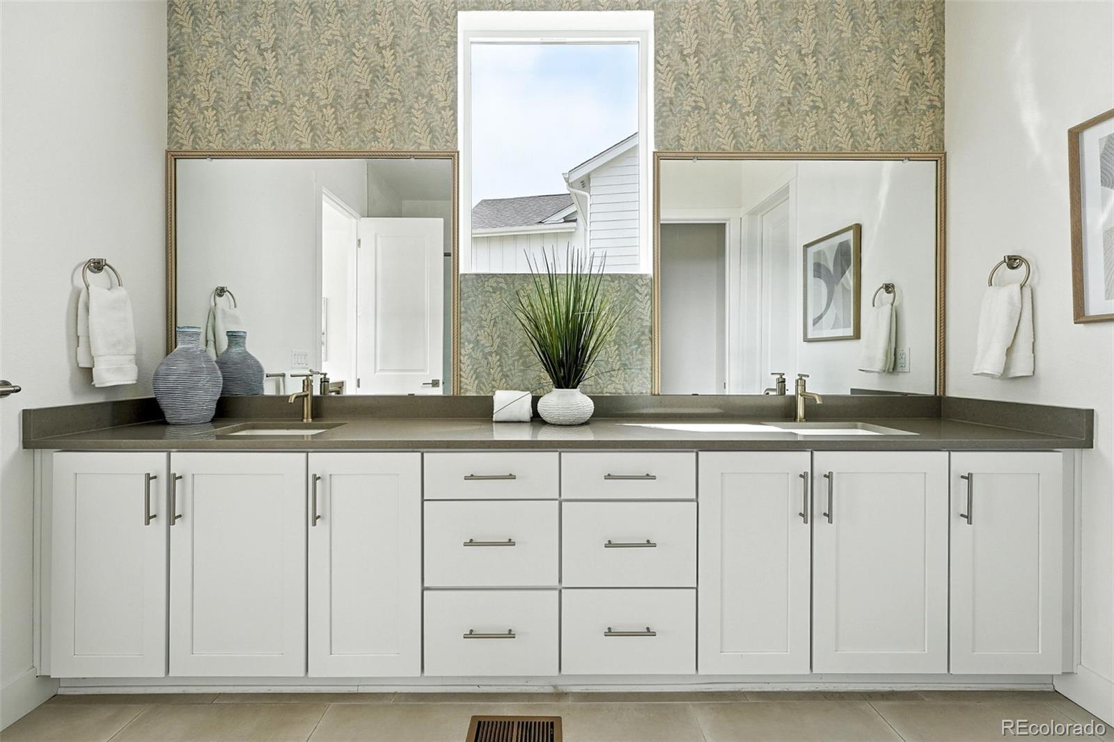 4855 Saddle Iron Road Castle Rock, CO 80104 - Photo 30 of 50 a bathroom with a sink and a mirror