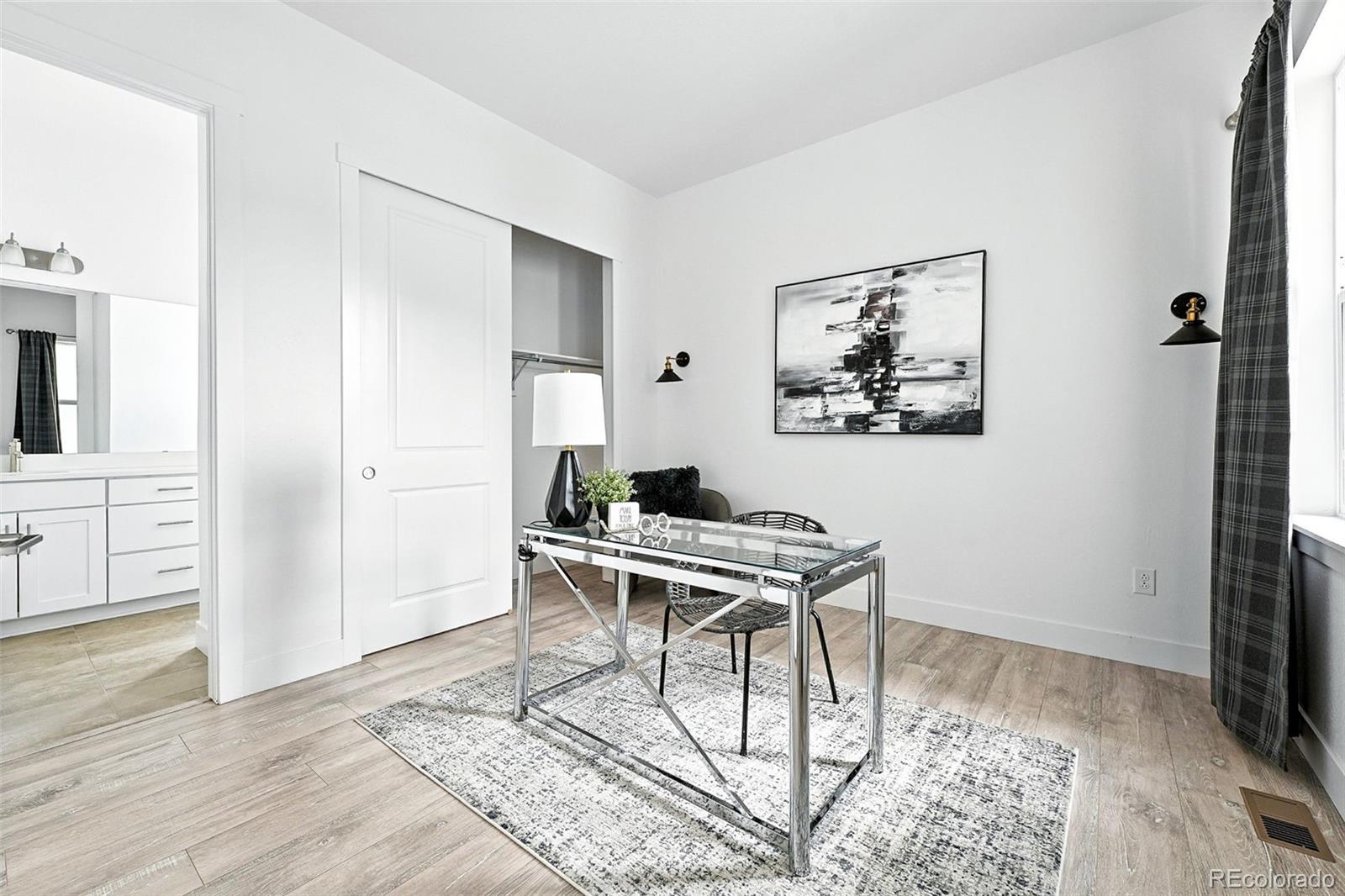 4855 Saddle Iron Road Castle Rock, CO 80104 - Photo 35 of 50 a work room with furniture a rug and a window