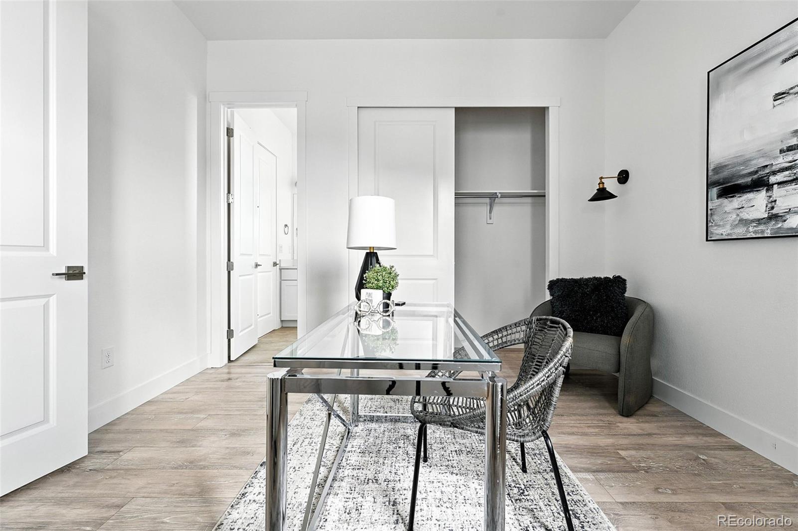 4855 Saddle Iron Road Castle Rock, CO 80104 - Photo 36 of 50 a view of a dining room with furniture and wooden floor
