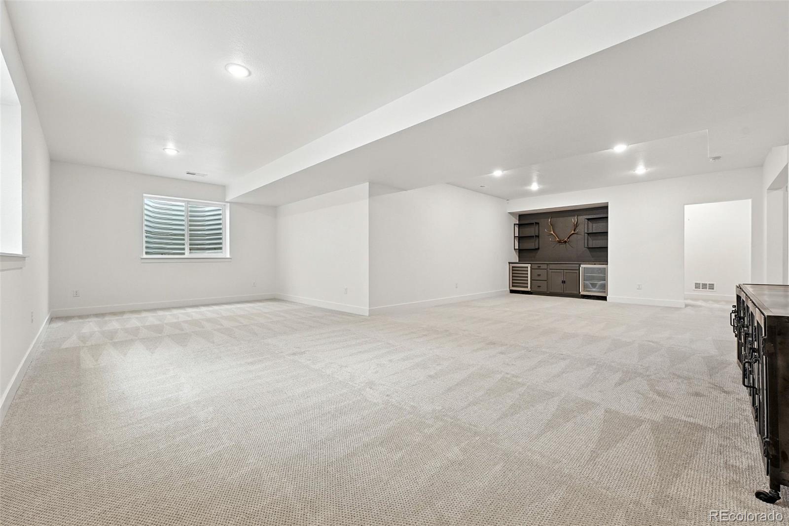 4855 Saddle Iron Road Castle Rock, CO 80104 - Photo 37 of 50 a view of an empty room with a window