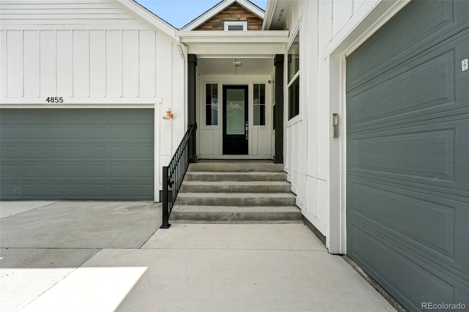 4855 Saddle Iron Road Castle Rock, CO 80104 - Photo 4 of 50 a view of a entrance front of house