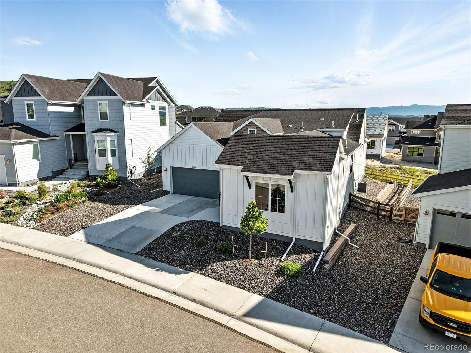 4855 Saddle Iron Road Castle Rock, CO 80104 - Photo 45 of 50 a front view of a house with garden