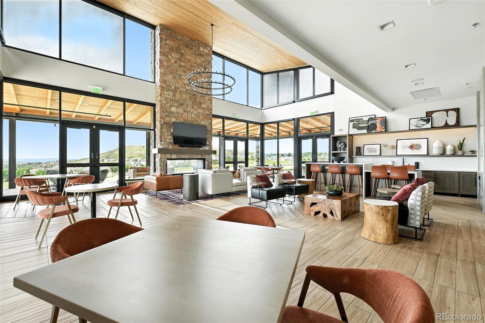 4855 Saddle Iron Road Castle Rock, CO 80104 - Photo 48 of 50 a living room with fireplace furniture and a large window