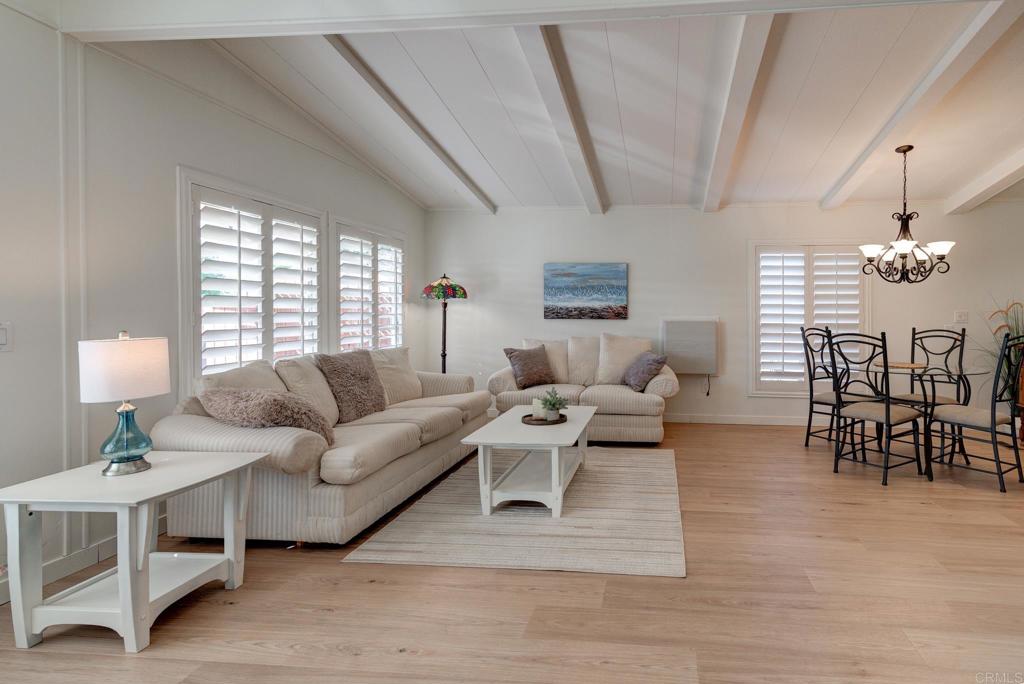 1010 Palm Canyon Drive, Unit 249 Borrego Springs, CA 92004 - Photo 11 of 23 a living room with furniture a dining table and a chandelier