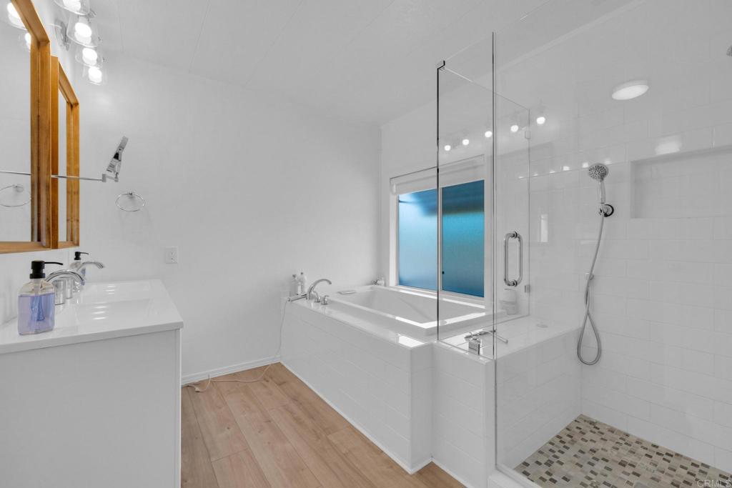 1010 Palm Canyon Drive, Unit 249 Borrego Springs, CA 92004 - Photo 15 of 23 a bathroom with a double vanity sink a mirror and a shower