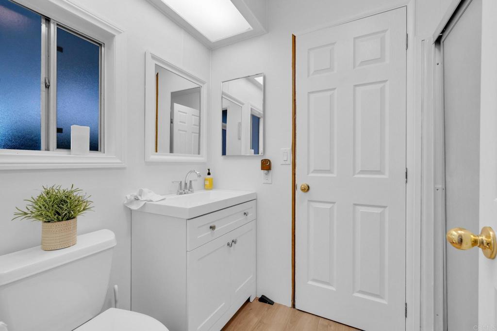 1010 Palm Canyon Drive, Unit 249 Borrego Springs, CA 92004 - Photo 17 of 23 a bathroom with a sink a toilet and a mirror