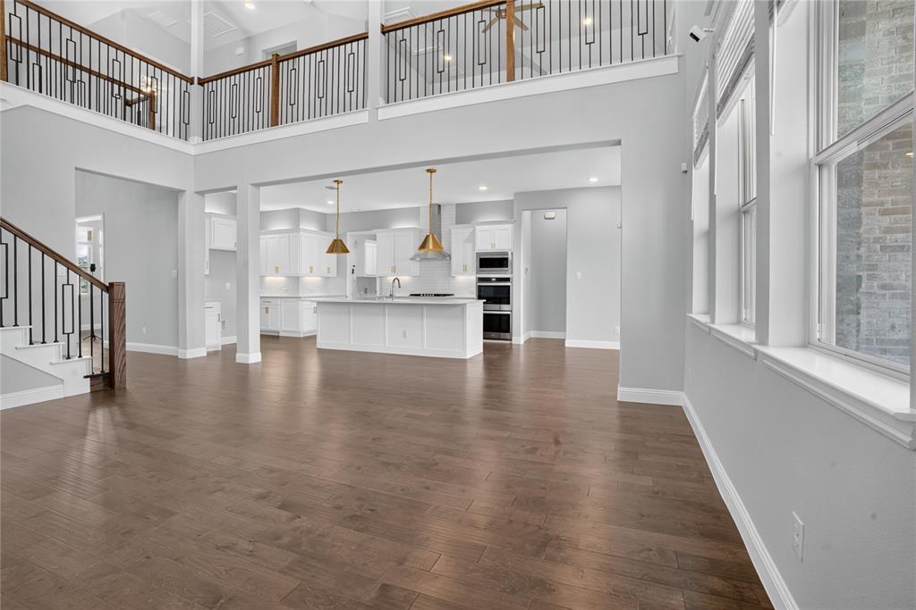 2528 Horsetail Road Frisco, TX 75033 - Photo 9 of 39 Upstairs game room and walkway is enhanced with premium designer railings that over look the soaring living area below creating an airy ambiance and dding a sophisticated architectural touch!