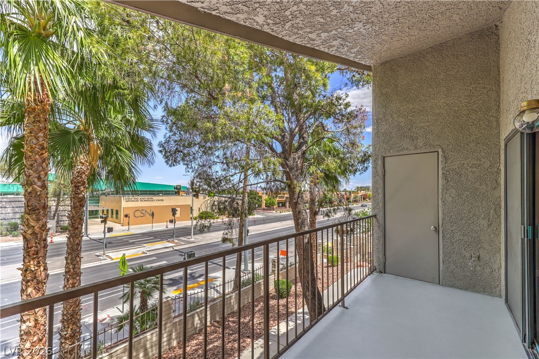 1575 West Warm Springs Road, Unit 322 Henderson, NV 89014 - Photo 22 of 25 This outdoor space offers a pleasant vantage point overlooking the vibrant streetscape.