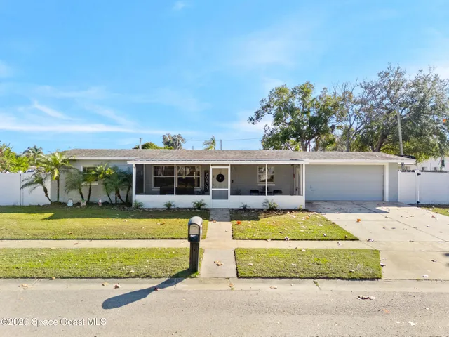 a view of a house with swimming pool and a yard