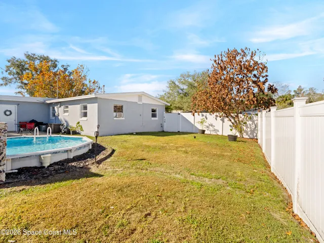 a bathroom with a sink mirror and vanity