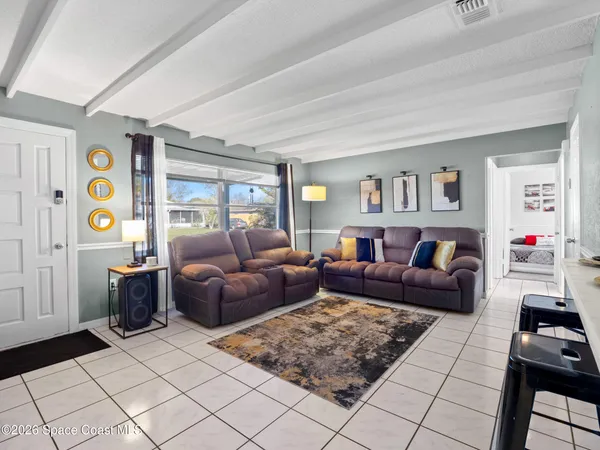 a living room with furniture and a window