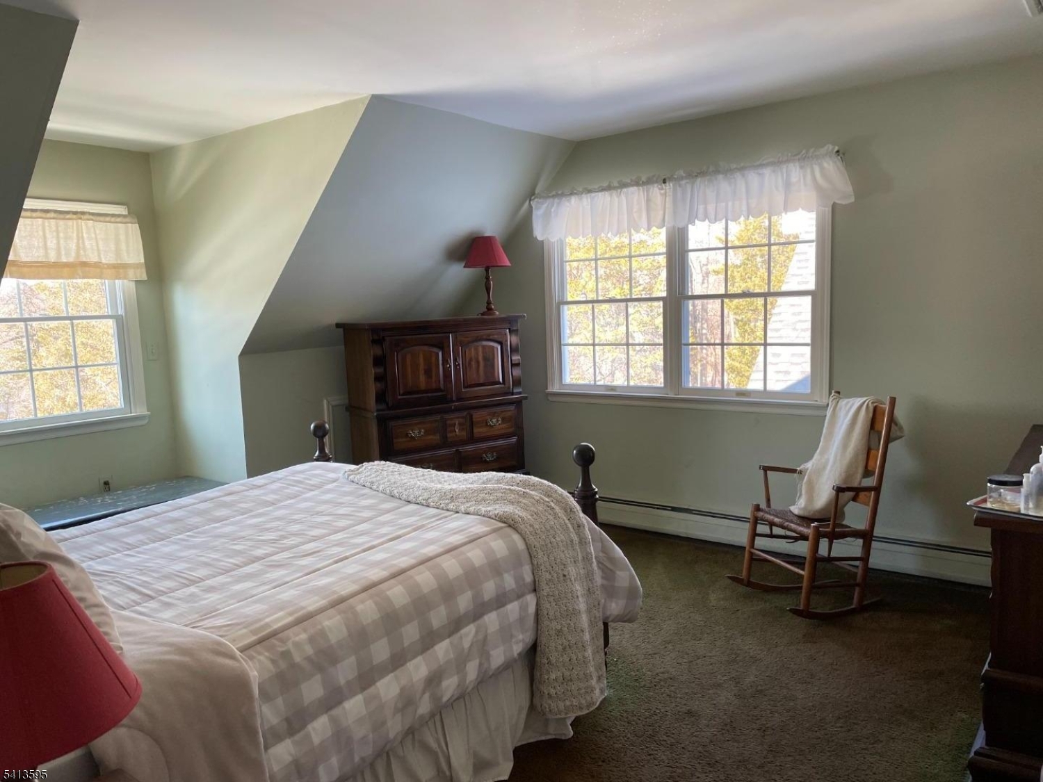 938 Potters Road Newton, NJ 07860 - Photo 15 of 26 a bedroom with a bed and a window