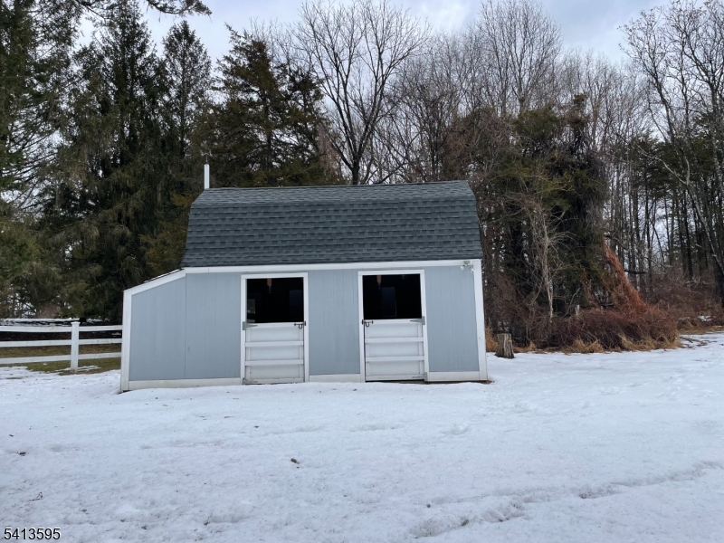 938 Potters Road Newton, NJ 07860 - Photo 26 of 26 a front view of a house with a yard and garage