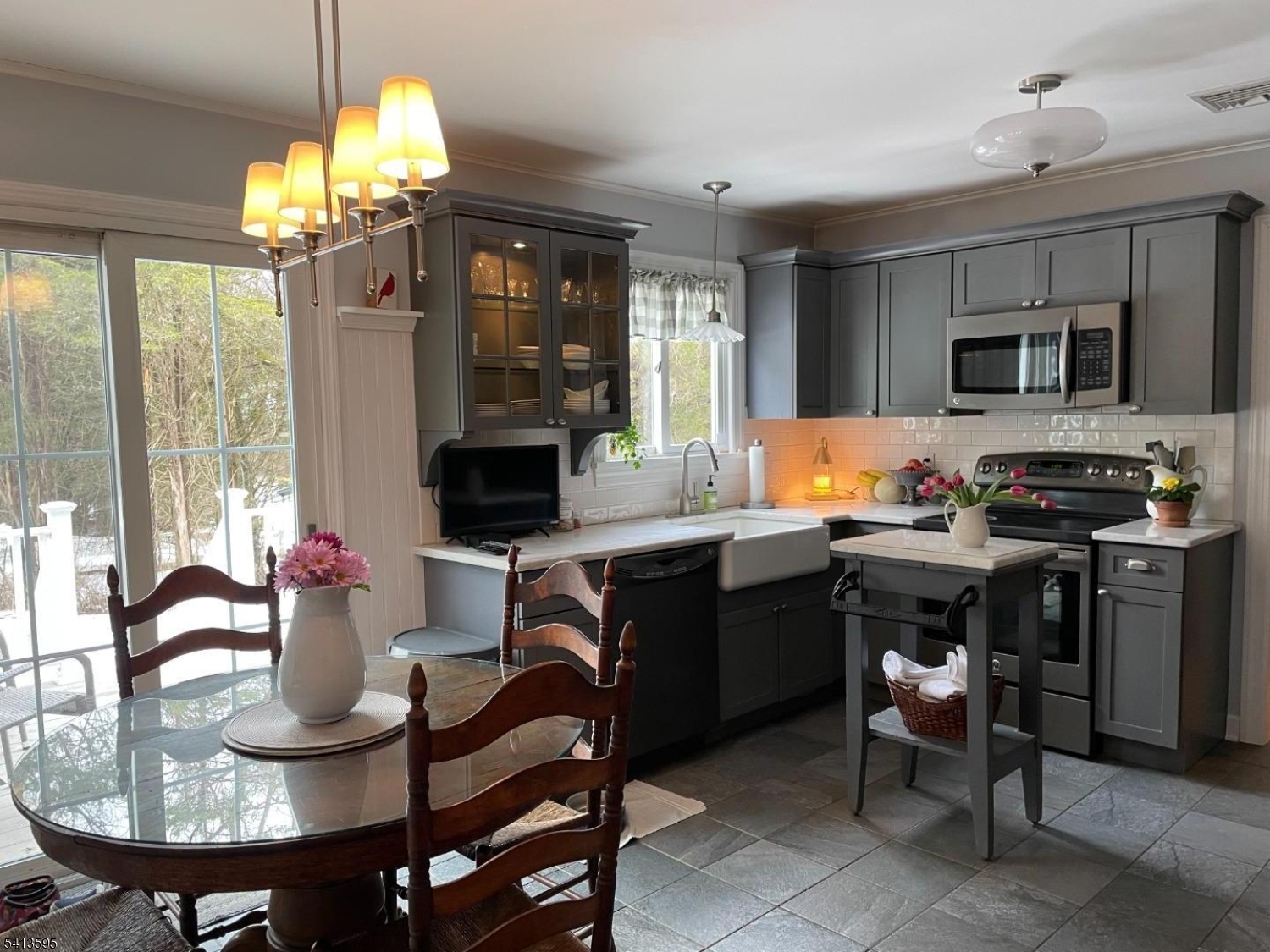 938 Potters Road Newton, NJ 07860 - Photo 4 of 26 a kitchen with a table and chairs