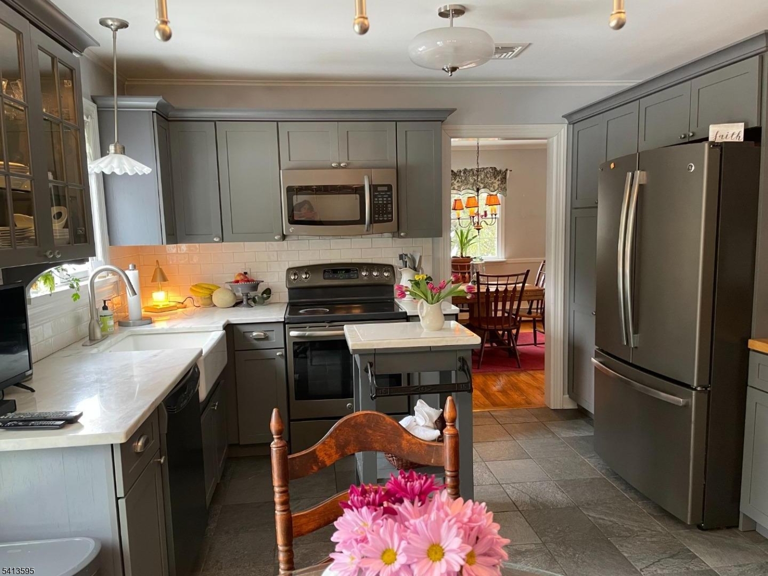 938 Potters Road Newton, NJ 07860 - Photo 5 of 26 a kitchen with a refrigerator stove and microwave