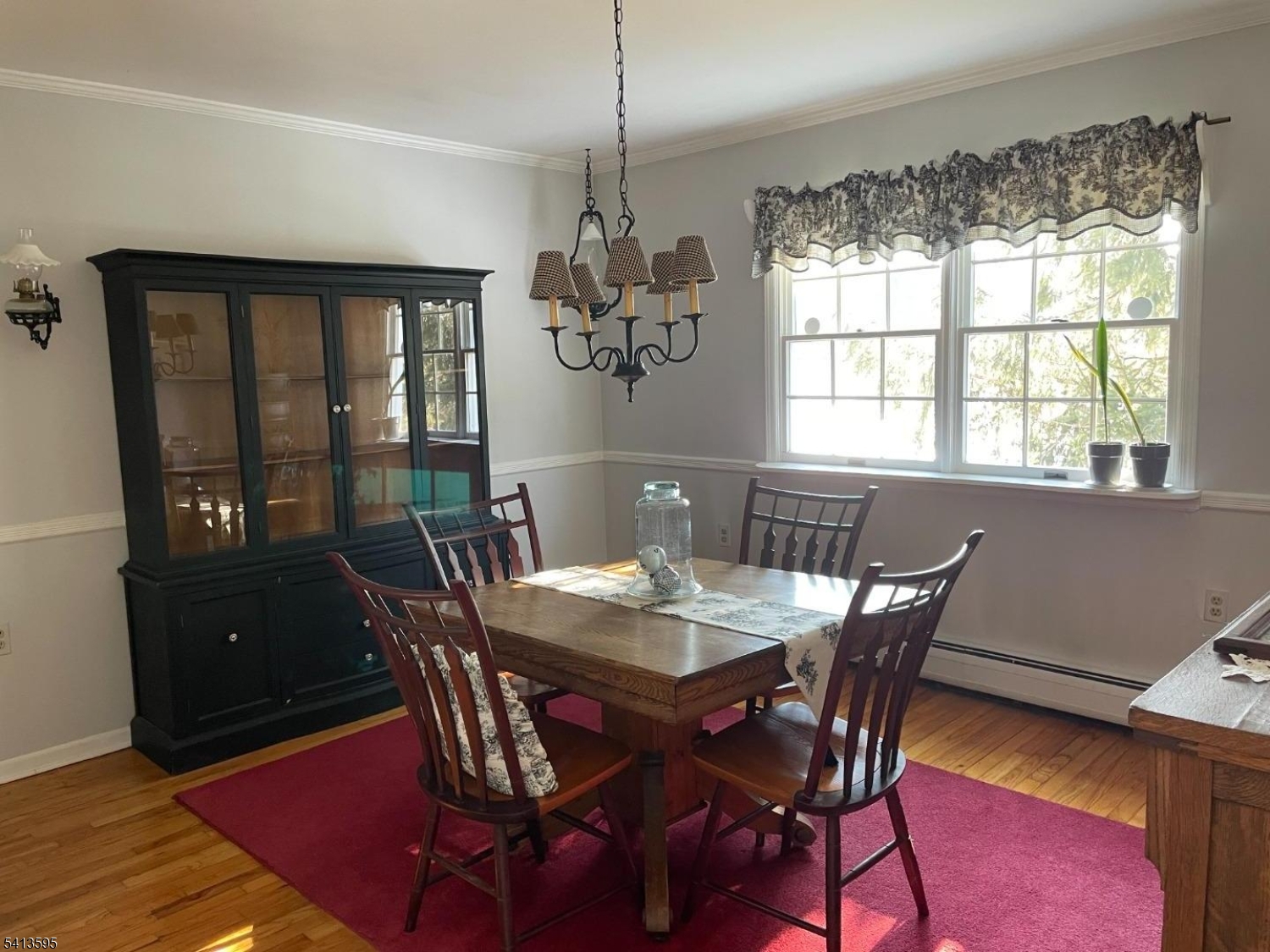 938 Potters Road Newton, NJ 07860 - Photo 6 of 26 a dining room with furniture a chandelier and wooden floor