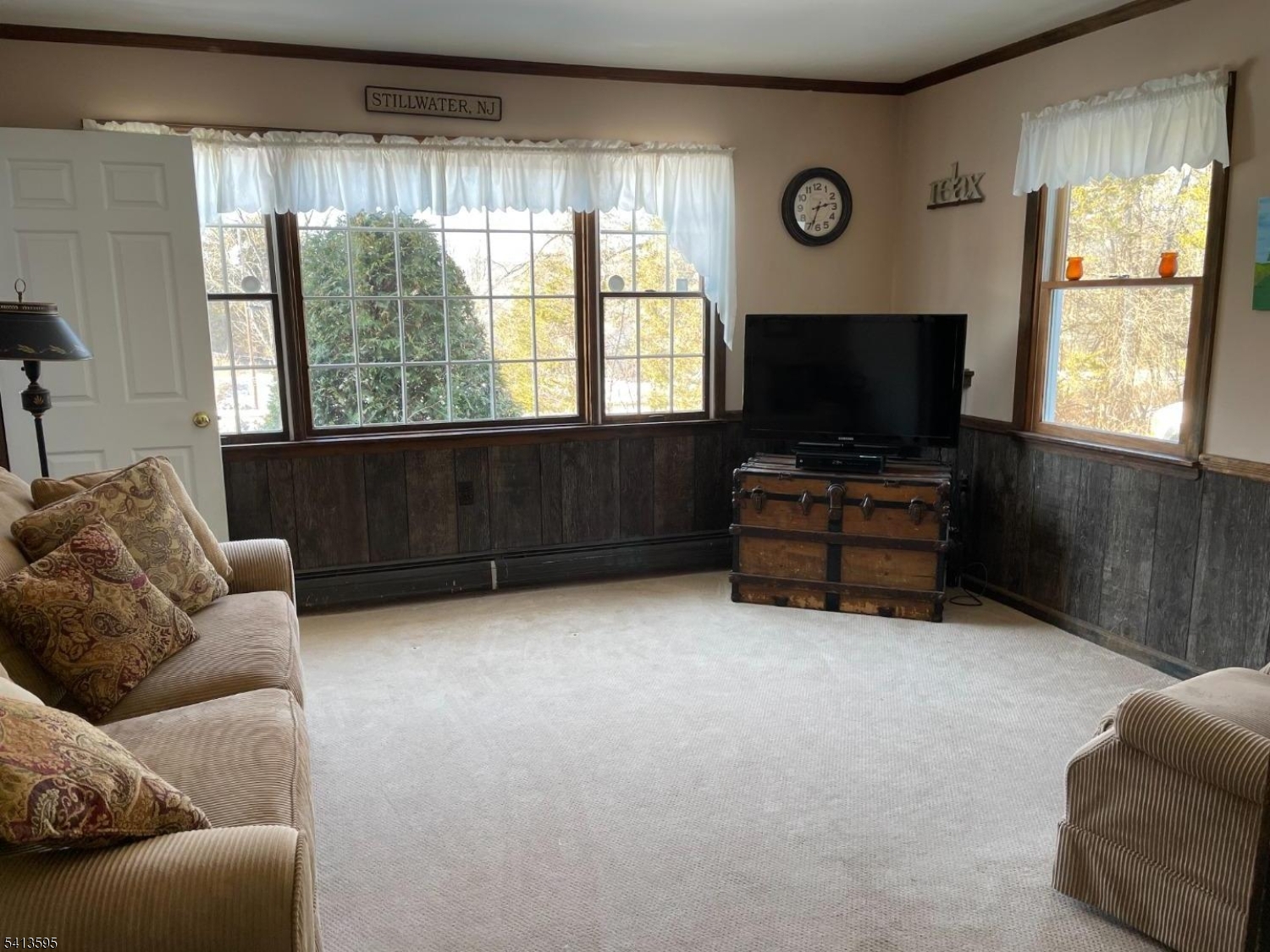 938 Potters Road Newton, NJ 07860 - Photo 9 of 26 a living room with furniture and a flat screen tv