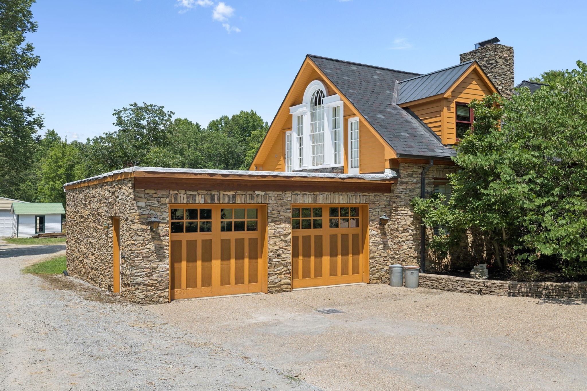 1374 Peter Pond Road Ashland City, TN 37015 - Photo 81 of 94 a view of a large house with a yard and balcony