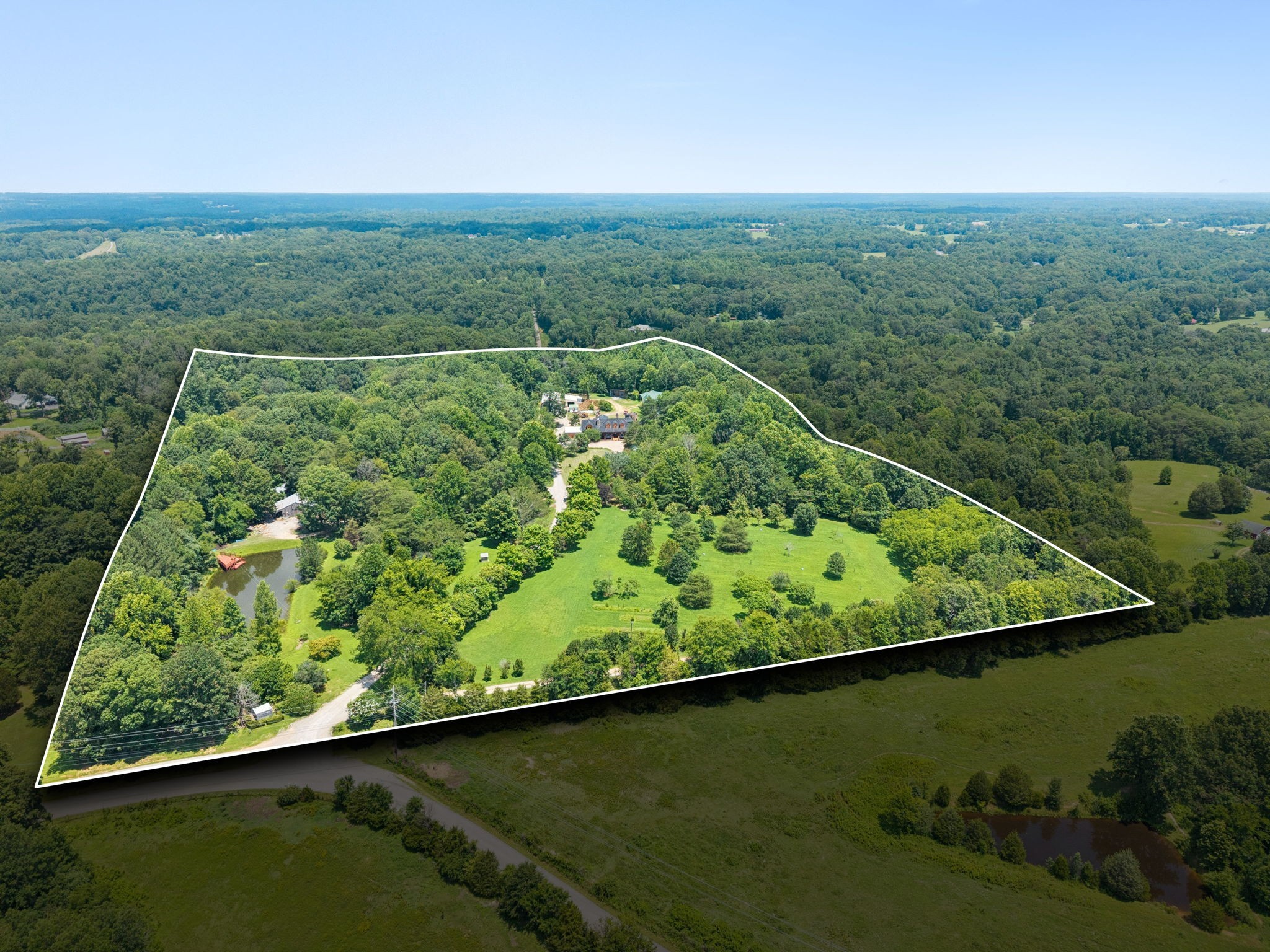 1374 Peter Pond Road Ashland City, TN 37015 - Photo 93 of 94 a view of a lush green field with a lake view