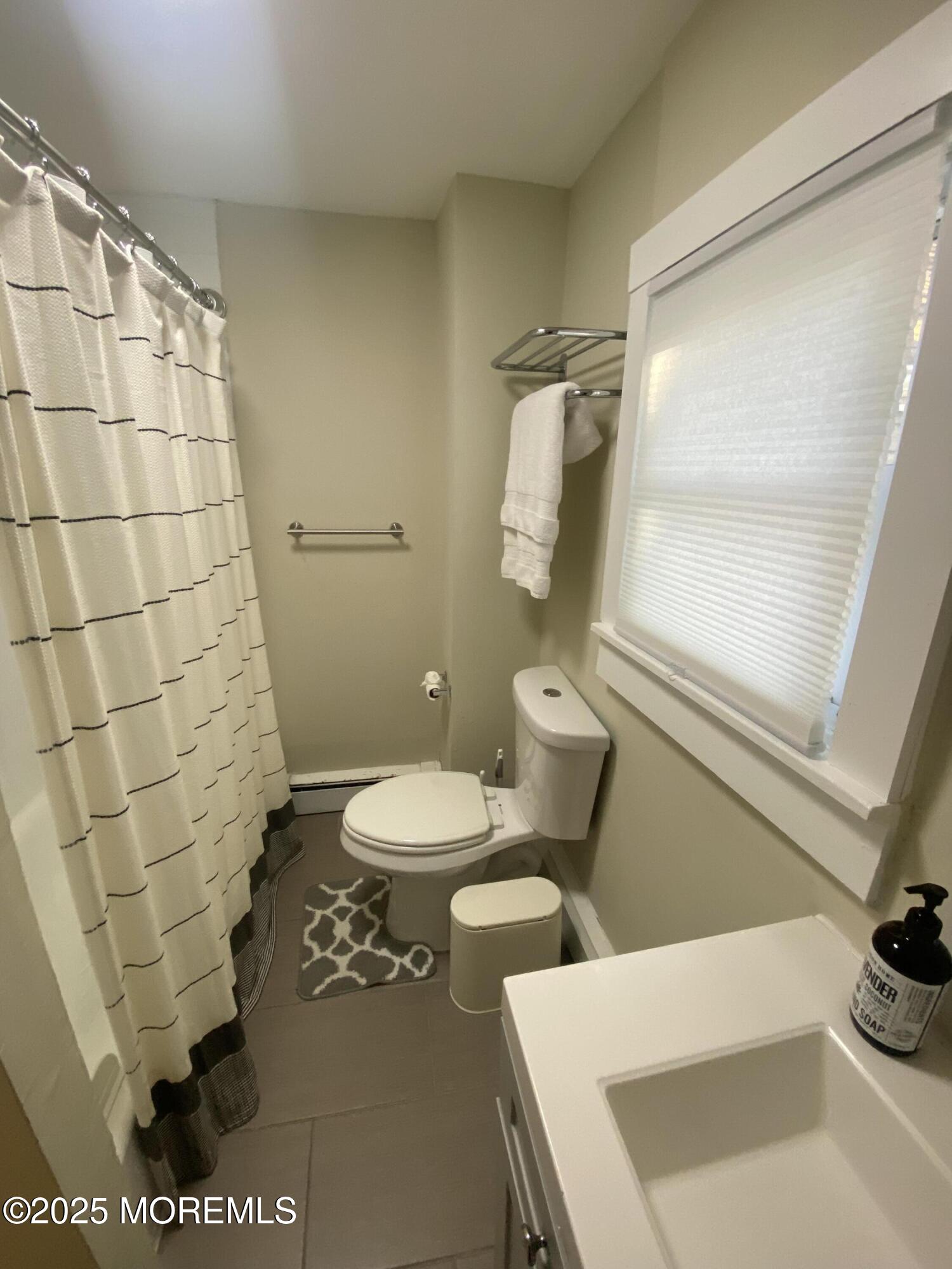 1204 Emory Street, Unit 2 Asbury Park, NJ 07712 - Photo 15 of 33 a bathroom with a toilet and a shower