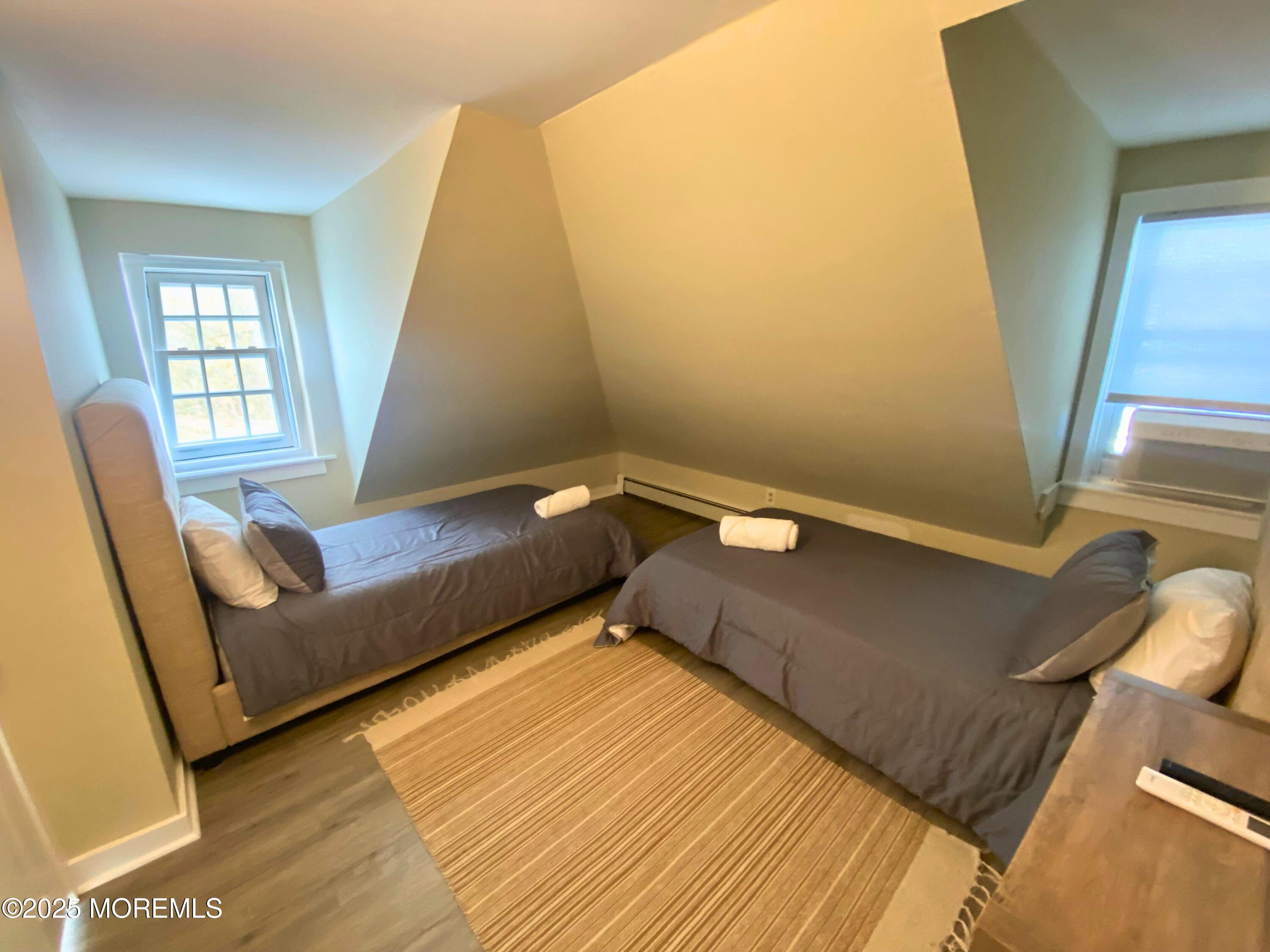 1204 Emory Street, Unit 2 Asbury Park, NJ 07712 - Photo 18 of 33 a living room with a couch