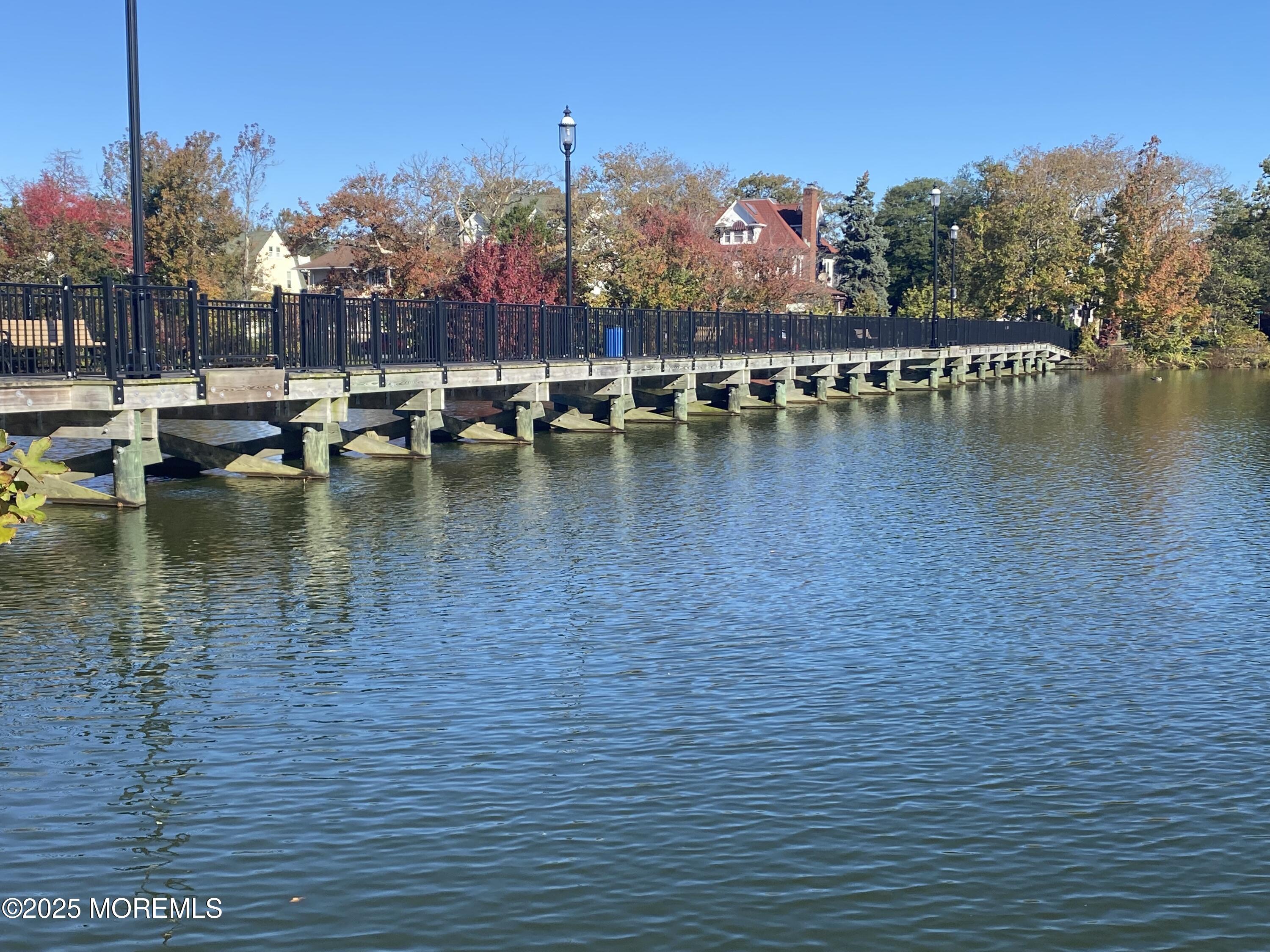 1204 Emory Street, Unit 2 Asbury Park, NJ 07712 - Photo 29 of 33 a view of water with boats and trees in the background