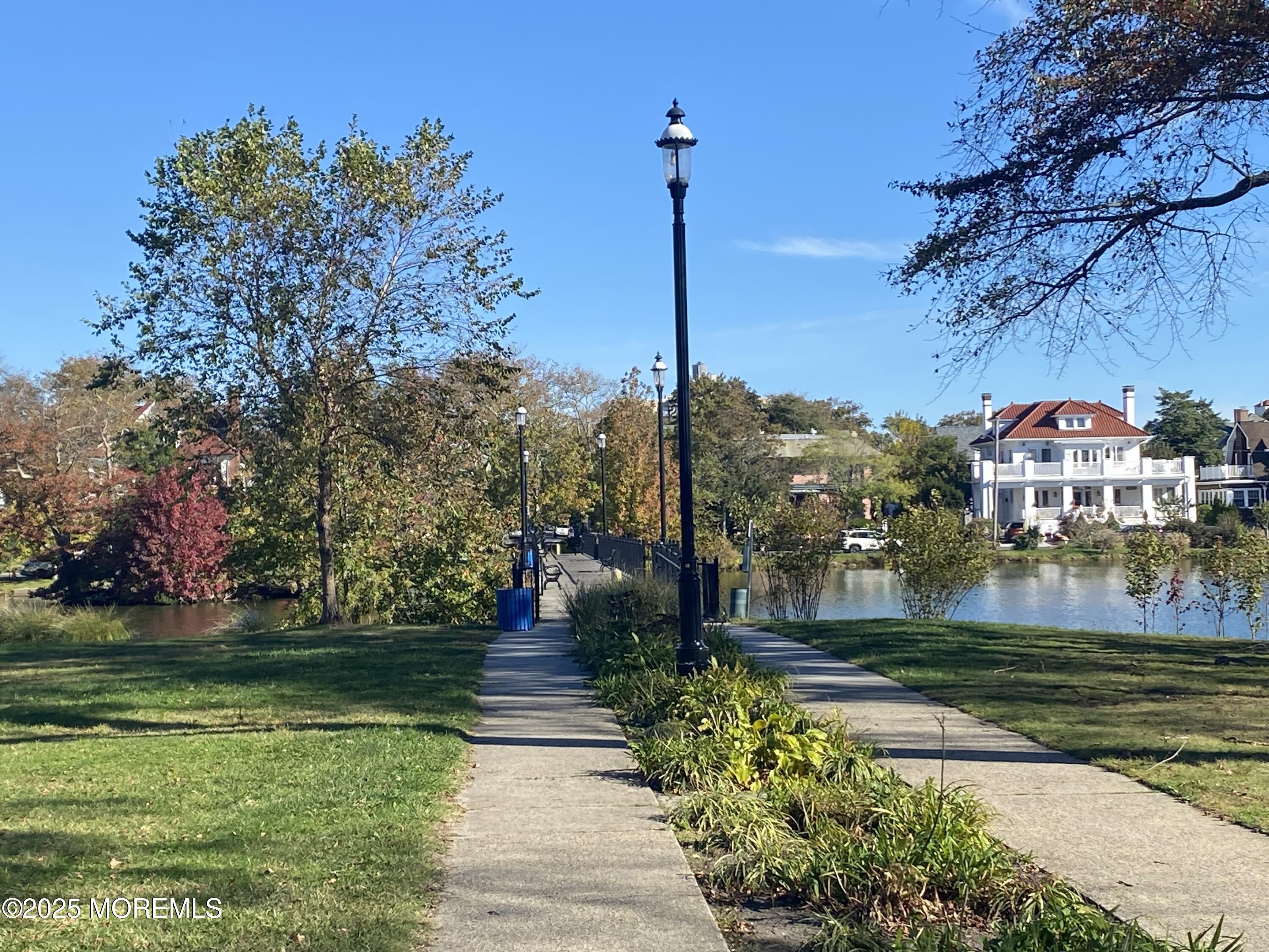 1204 Emory Street, Unit 2 Asbury Park, NJ 07712 - Photo 30 of 33 a front view of a house with a yard