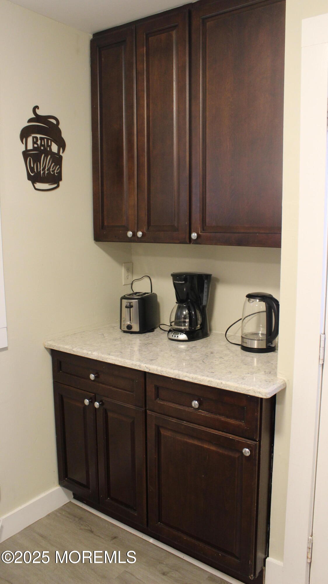 1204 Emory Street, Unit 2 Asbury Park, NJ 07712 - Photo 8 of 33 a view of cabinets with wooden floor