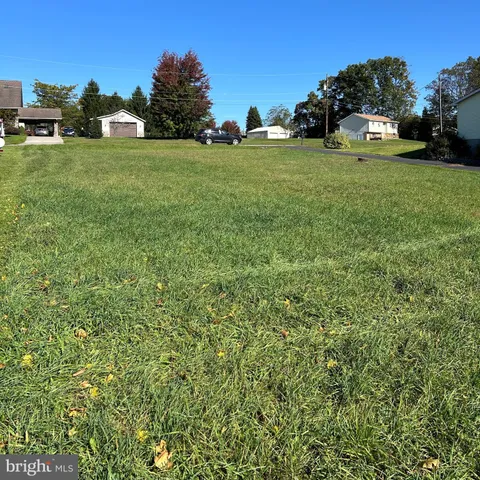 a view of outdoor space with deck and yard