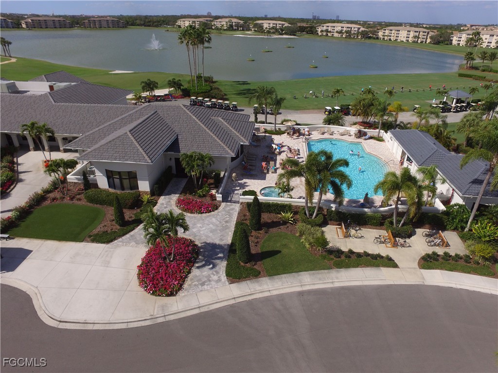 10461 Washingtonia Palm Way, Unit 3435 Fort Myers, FL 33966 - Photo 20 of 36 an aerial view of a house with yard swimming pool and outdoor seating