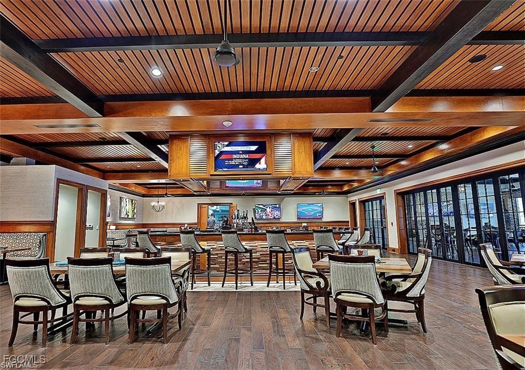10461 Washingtonia Palm Way, Unit 3435 Fort Myers, FL 33966 - Photo 24 of 36 a view of a bar restaurant