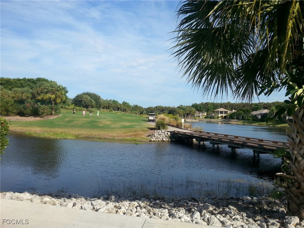 10461 Washingtonia Palm Way, Unit 3435 Fort Myers, FL 33966 - Photo 31 of 36 a view of a lake with a mountain