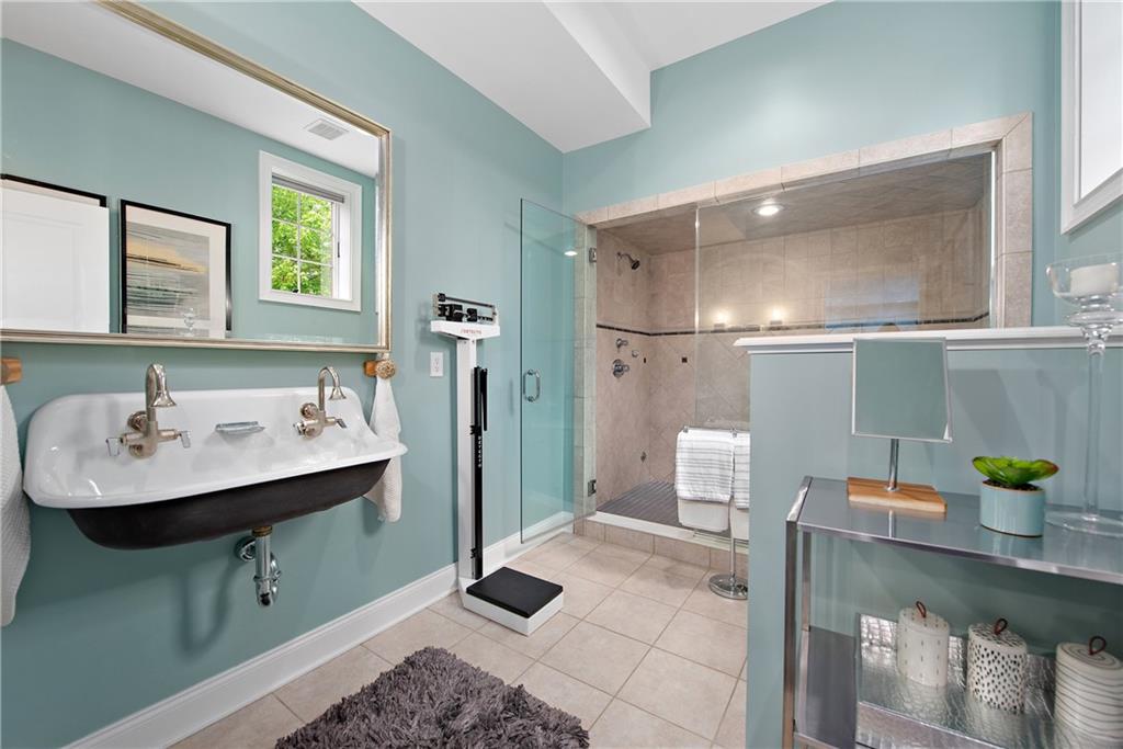 1706 Hastings Mill Road Pittsburgh, PA 15241 - Photo 23 of 25 a bathroom with a sink a toilet and shower