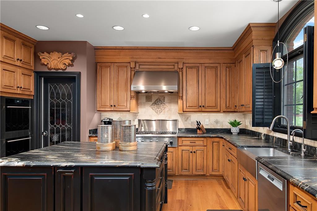 1706 Hastings Mill Road Pittsburgh, PA 15241 - Photo 8 of 25 a kitchen with stainless steel appliances granite countertop a sink a stove and a microwave