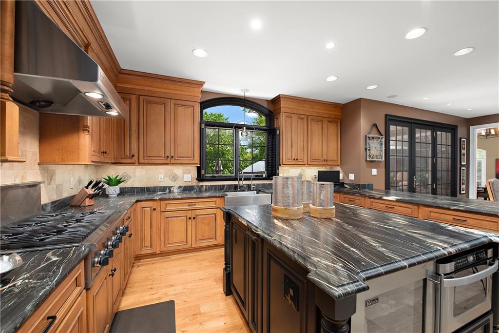 1706 Hastings Mill Road Pittsburgh, PA 15241 - Photo 9 of 25 a kitchen with a stove sink and cabinets