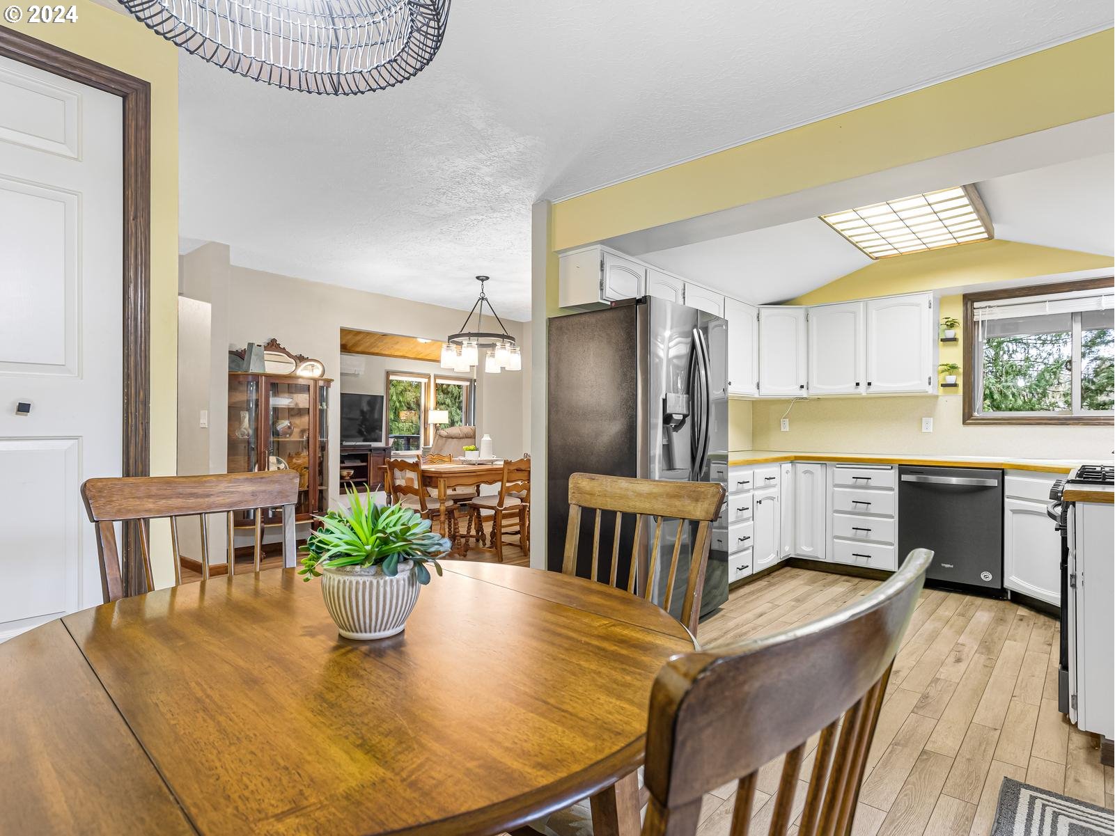 18550 Southeast Jacoby Road Sandy, OR 97055 - Photo 11 of 47 a view of kitchen with furniture and wooden floor