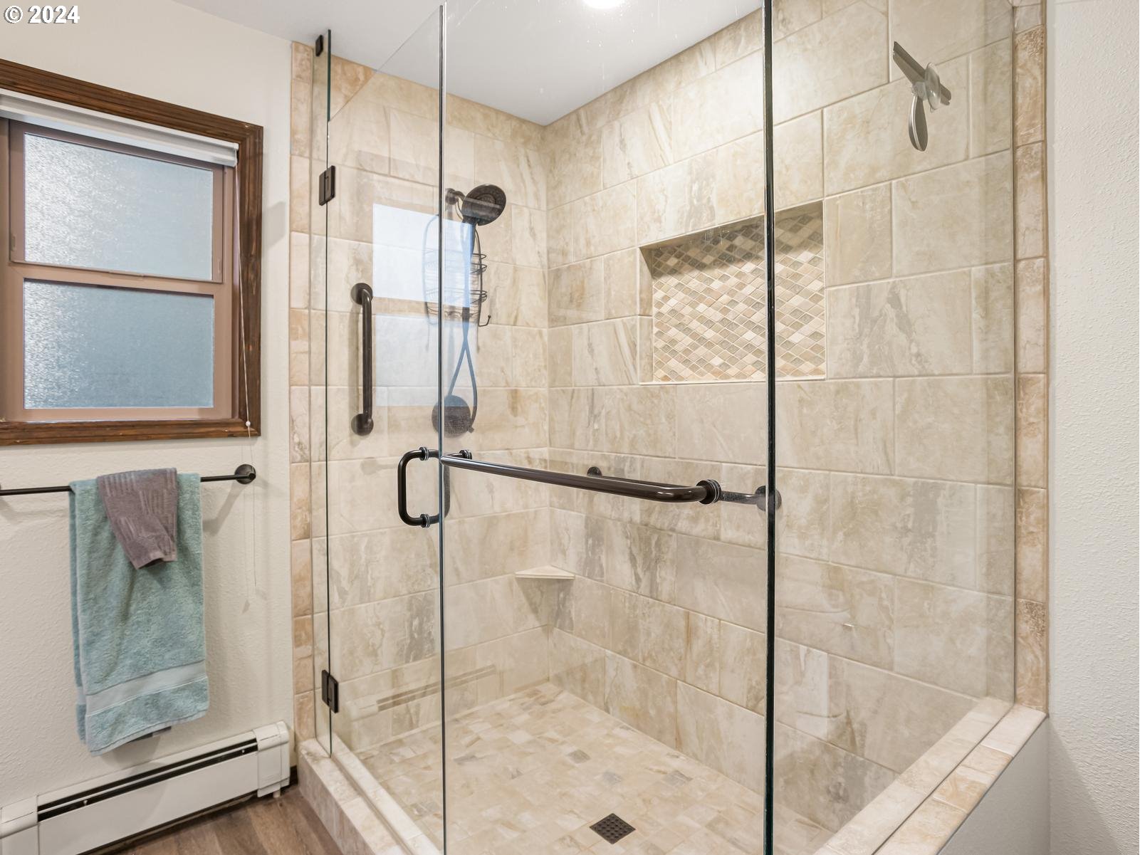18550 Southeast Jacoby Road Sandy, OR 97055 - Photo 23 of 47 a bathroom with a glass shower door