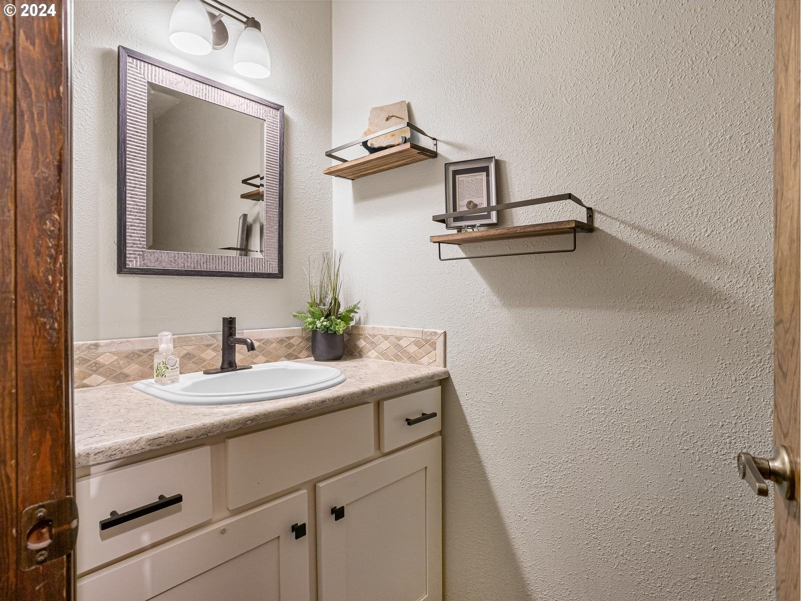 18550 Southeast Jacoby Road Sandy, OR 97055 - Photo 24 of 47 a bathroom with a sink and a mirror